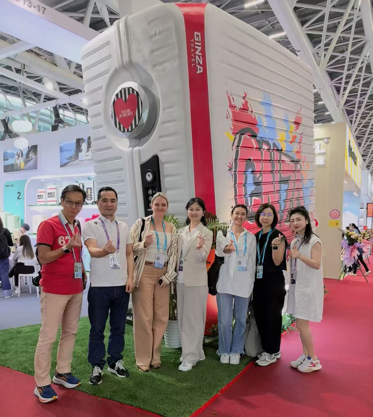 GNZA booth at the Canton Fair with hard-shell luggage and plastic product displays